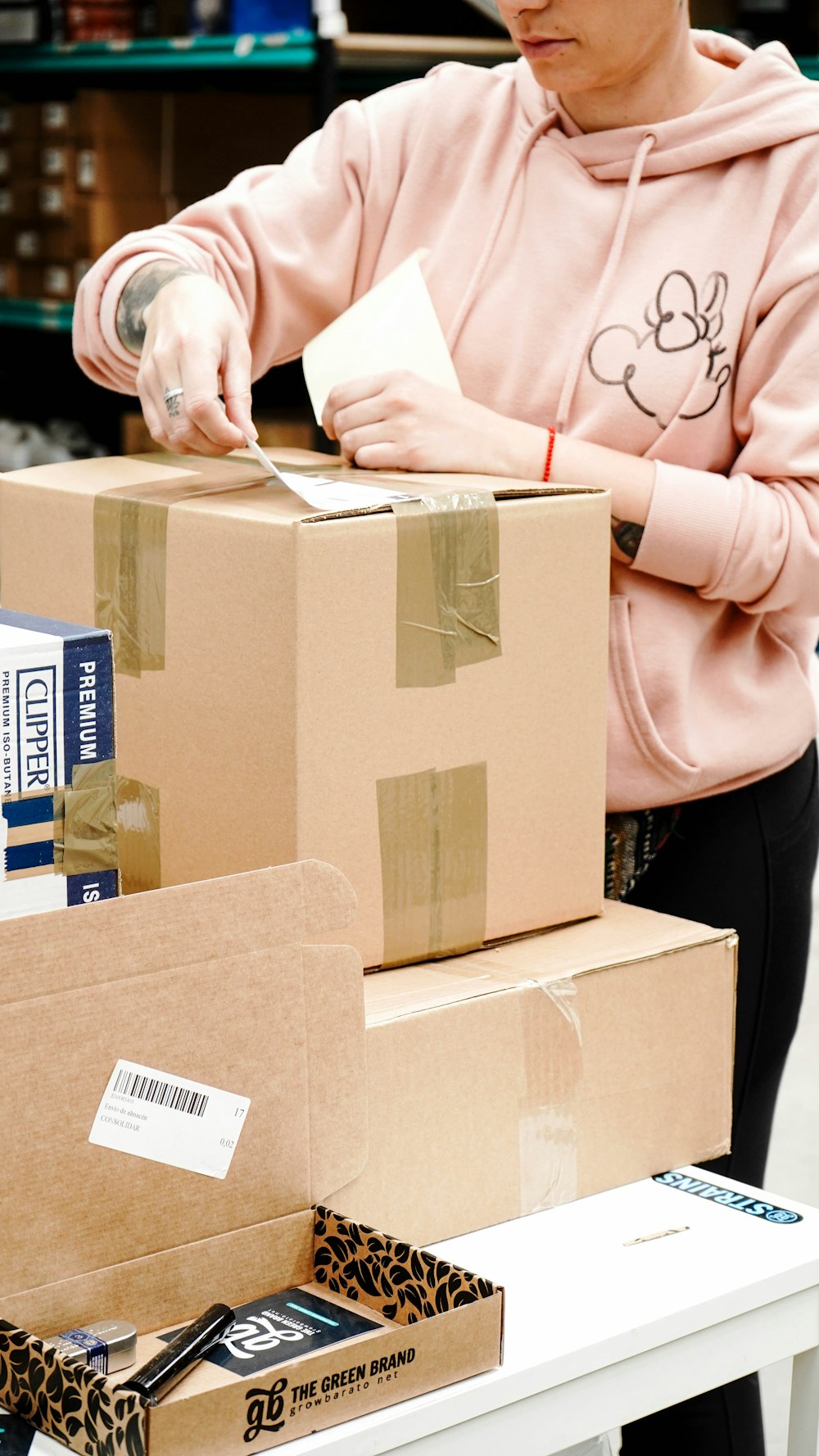 Labelling a carton at a packing bench
