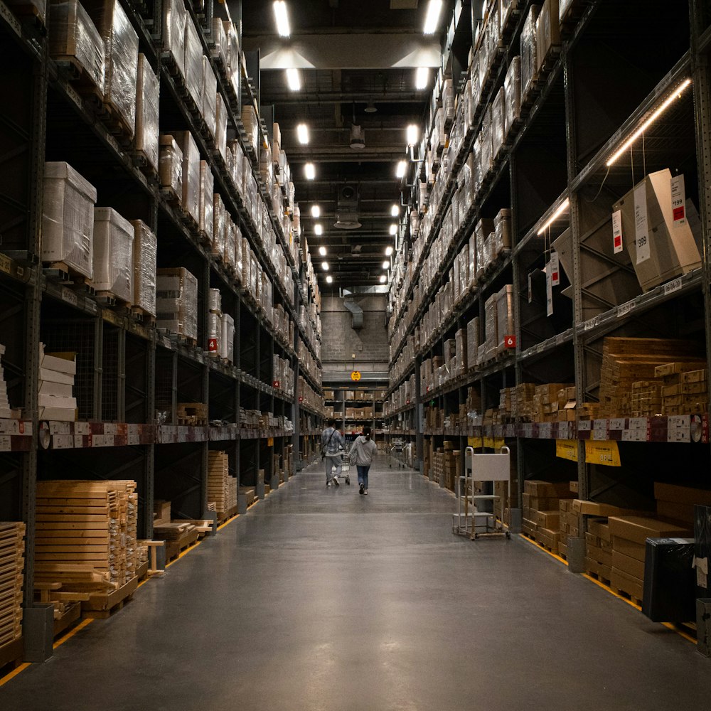 Long aisle of warehouse racking stacked with cartons